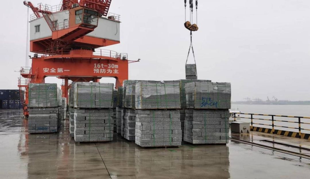 Stone slabs being loaded at port for shipping