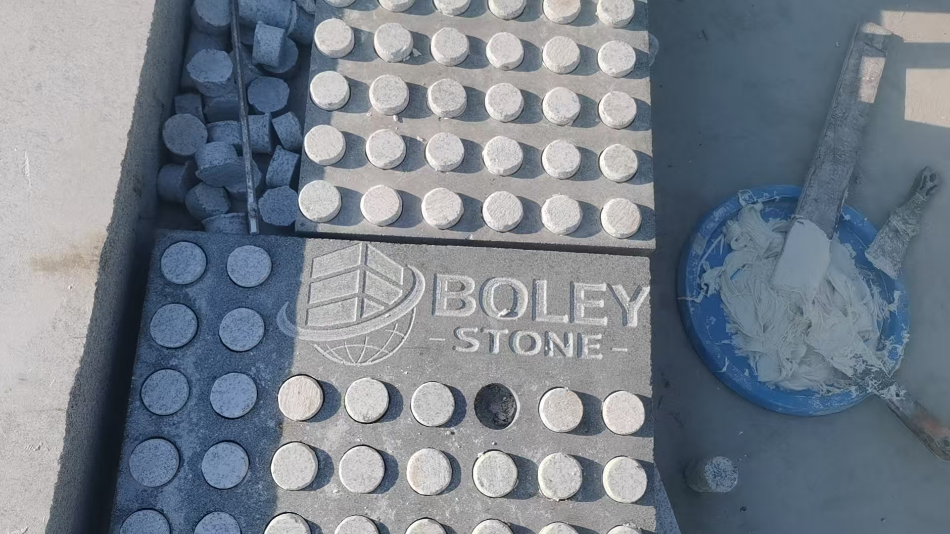 Solid stone tactile indicators with Boley Stone logo